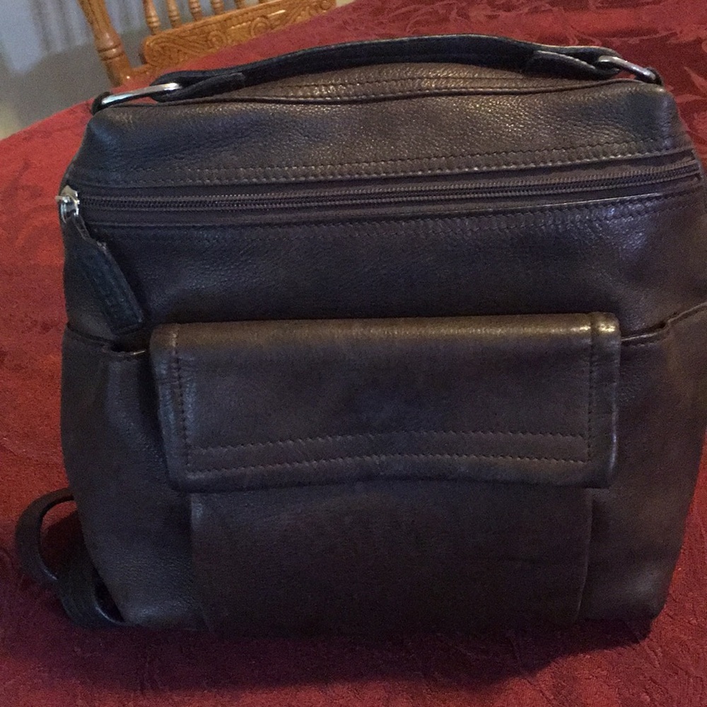 Dark brown leather fossil backpack bag.